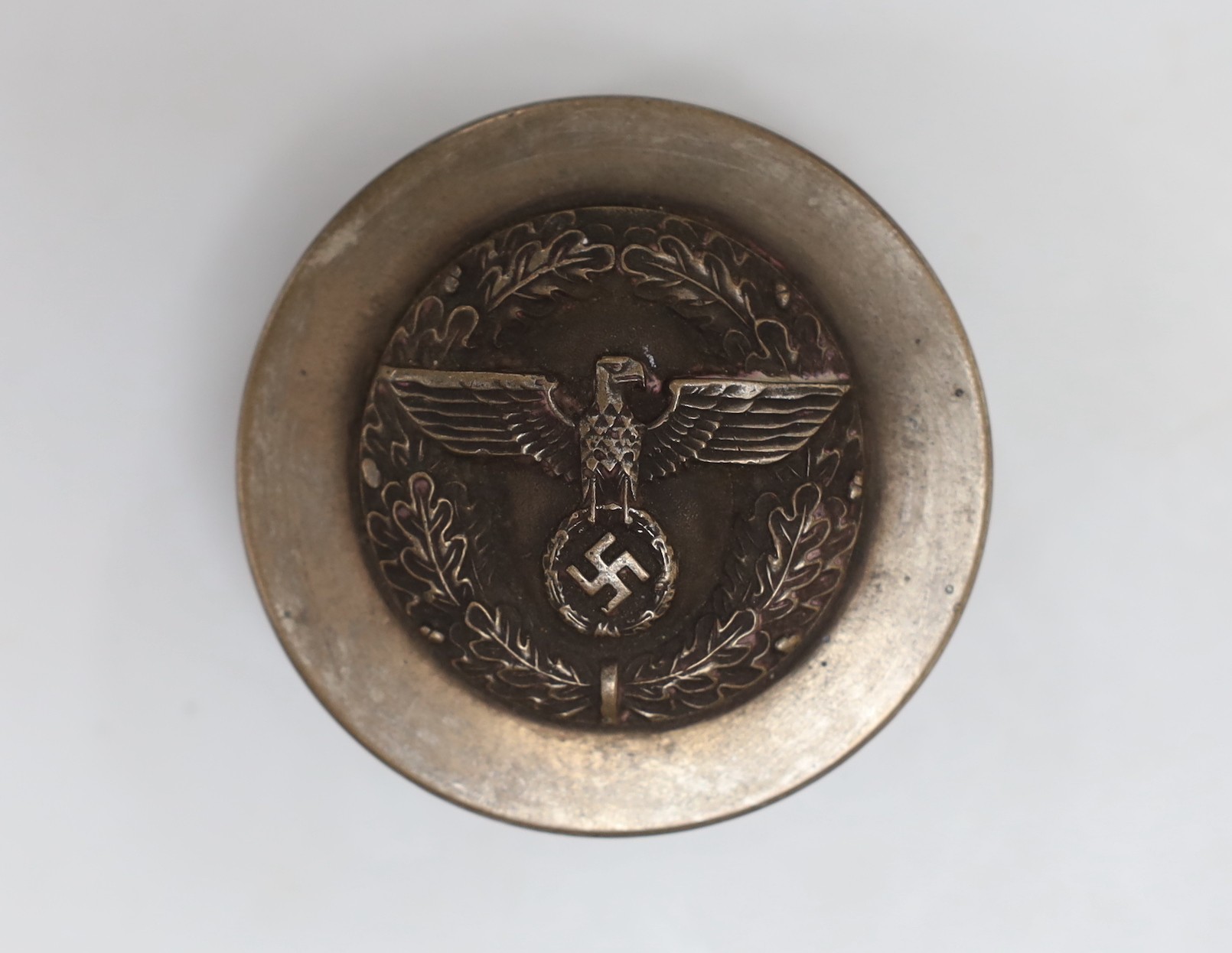 A composition and metal snuff box, with Third Reich insignia. 7cm diameter